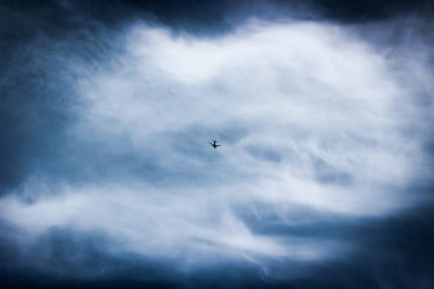 istock Airplane in a moody sky 1399789160
