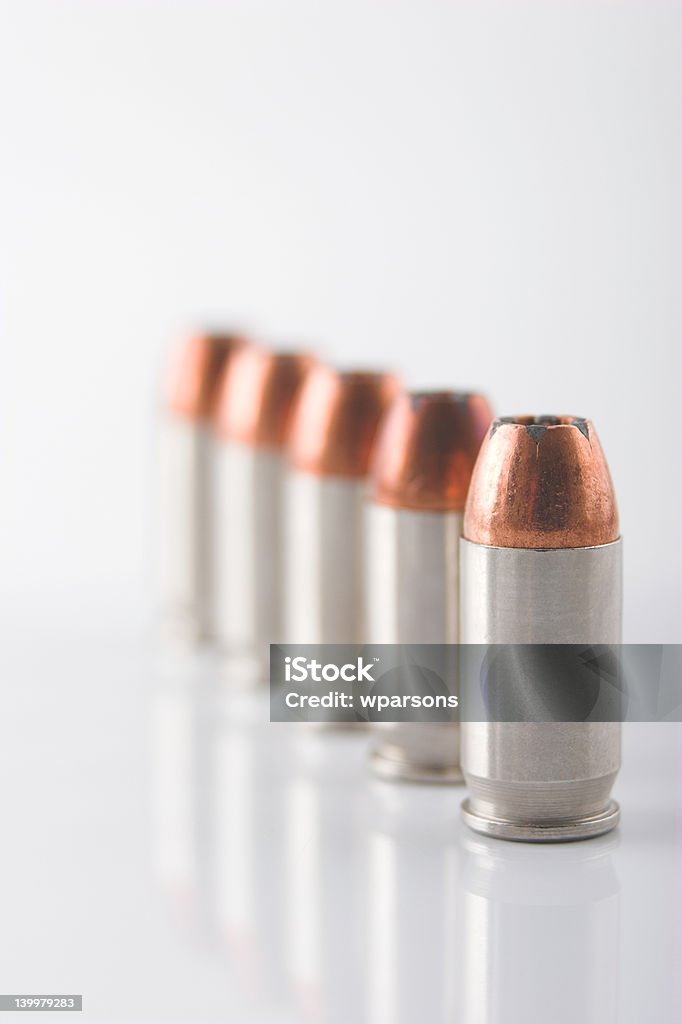 Row of bullets Row of pistol cartridges standing up Ammunition Stock Photo