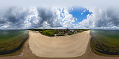 Baltic sea with a sandy beach on a summer day (360-degree aerial view)