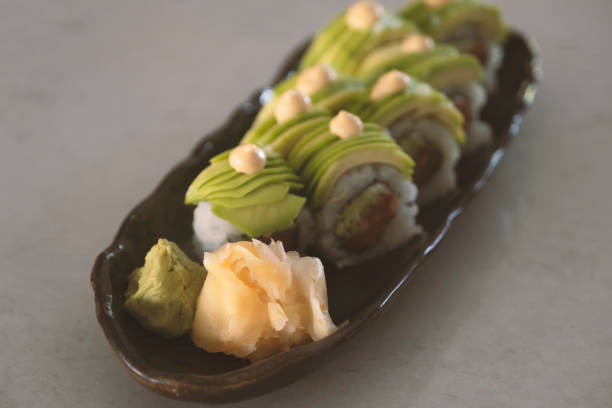 istock Dragon sushi roll covered with avocado pieces 1399796240