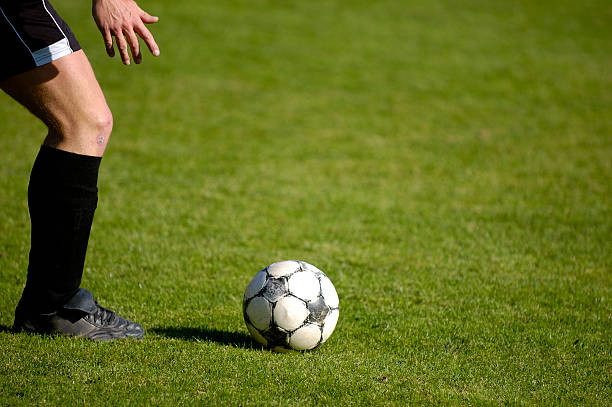 istock Ready to kick the football (soccer ball) 139979677