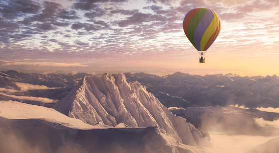 Dramatic Mountain Landscape covered in clouds and Hot Air Balloon Flying. 3d Rendering Adventure Dream Concept Artwork. Aerial Image from British Columbia, Canada. Sunset or Sunrise Sky