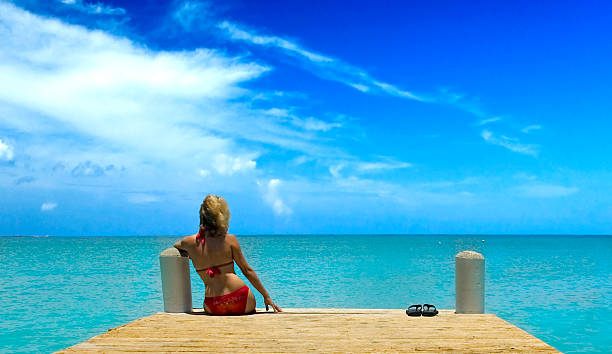 Pretty girl on a dock stock photo