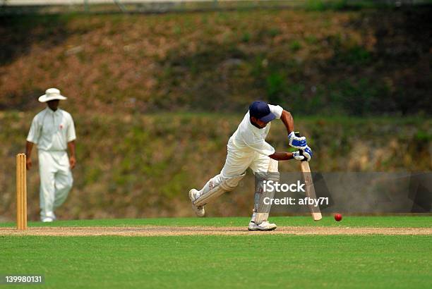 Cricket Batsman Swinging At A Pitch Stock Photo - Download Image Now - Sport of Cricket, Agricultural Field, Athlete