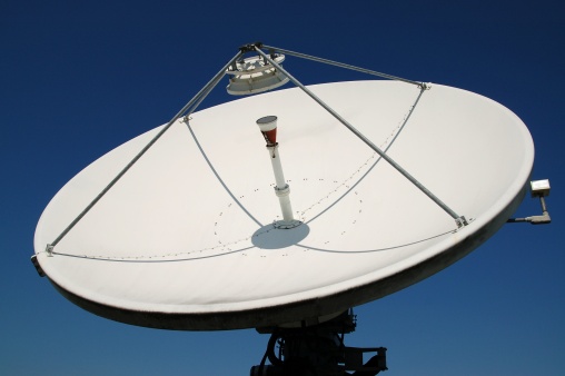 a large uplink and downlink television satellite dish