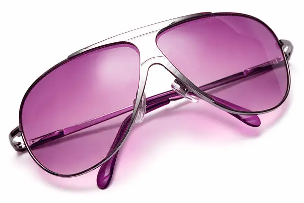 Pink sunglasses isolated on white.