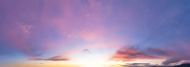 istock Panoramic View of Cloudscape during a colorful sunset or sunrise. 1399801844