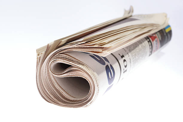 istock Rolled newspaper ready to go in the recycle bin 139980404