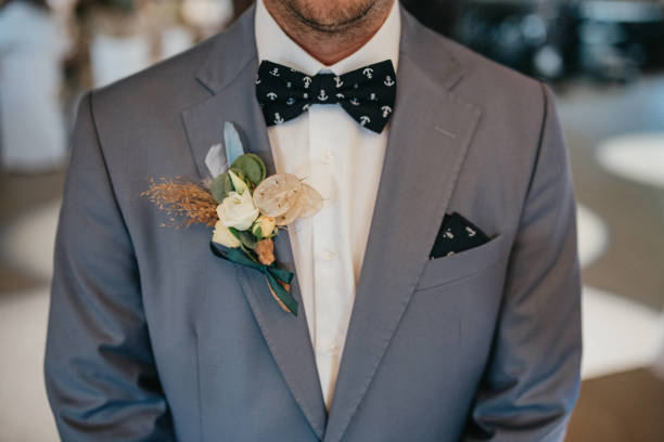 istock Young handsome man in a tuxedo and bow tie. 1399804211
