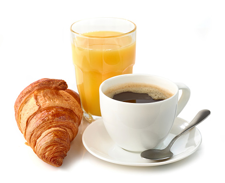 Coffee to go. Paper cup with tasty drink, croissant and beans on white wooden table, flat lay