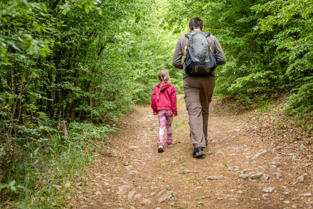 istock Father and daughter hiking together 1399805245