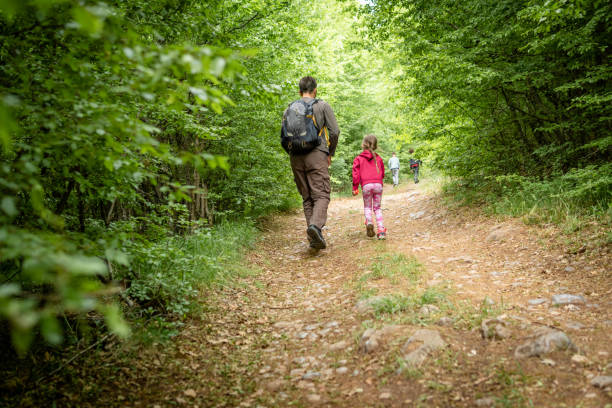 istock Father and daughter hiking together 1399805263