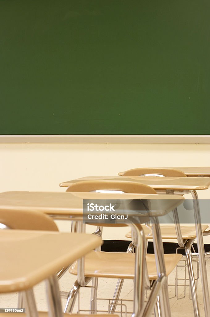 school is in desks in classroom Absence Stock Photo