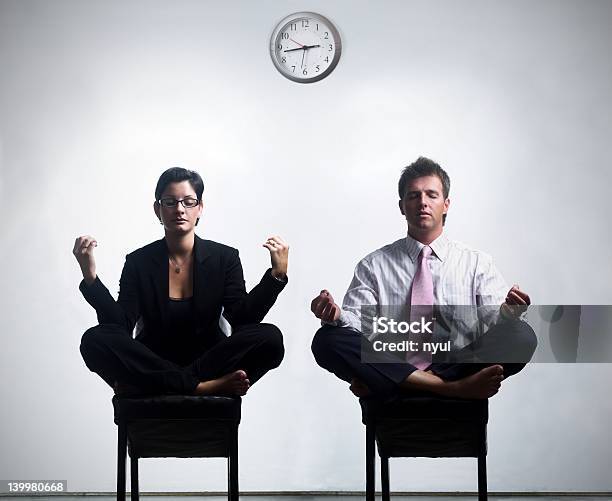 Two Business People Meditating During Their Break Stock Photo - Download Image Now - 25-29 Years, 30-34 Years, Adults Only