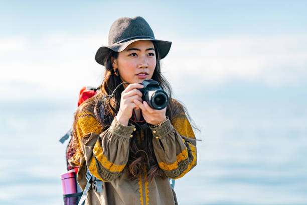 istock Young female traveller enjoying spending time at beach on her vacation 1399808372