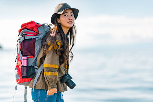 istock Young female traveller enjoying spending time at beach on her vacation 1399808589