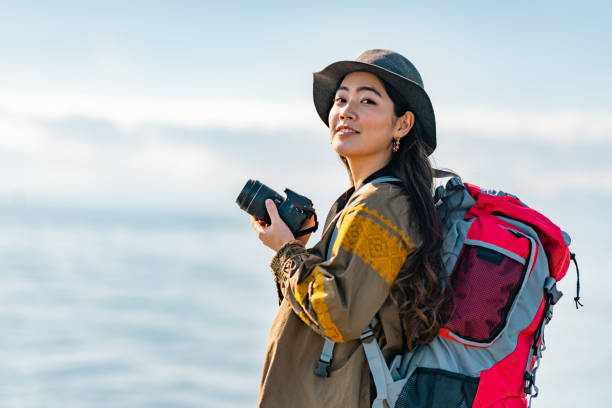 istock Young female traveller enjoying spending time at beach on her vacation 1399809119
