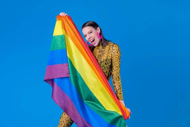 istock Excited woman with LGBT flag in studio 1399809619