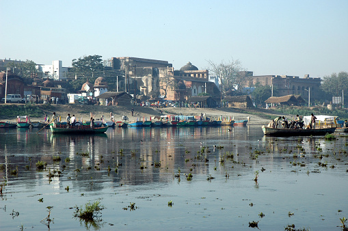 Pilgrims in Vrindavan town crossing river for morning prayers