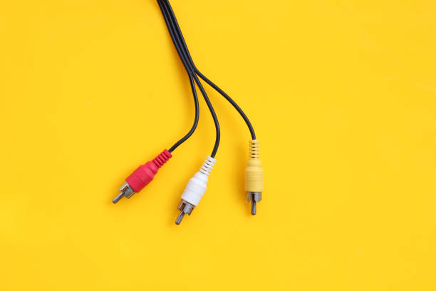 istock Audio and video cables on yellow background 1399811267