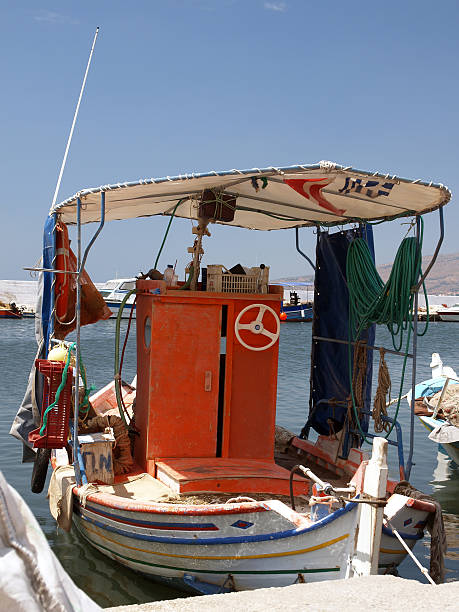 colourful greek fishing boat stock photo