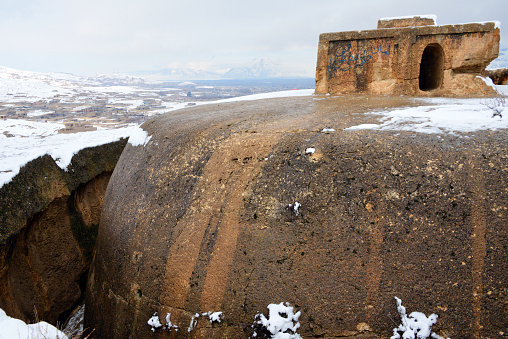 Takht-e Rustam, Aybak, Samangan Province, Afghanistan: Takht-e Rustam, meaning 'Rustam's throne', Buddhist stupa cut into a mountain, resembling the monolithic churches of Ethiopia, part of a stupa-monastery dating from the Kushano-Sasanian period 4th-5th century AD - the square building atop the stupa is the 'Harmika', it once held relics of the Buddha. The circular corridor was used by pilgrims for circumambulation.