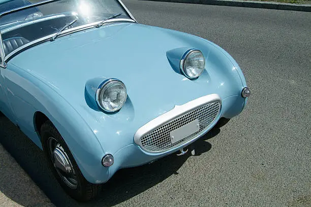Front of vintage, light blue sportscar