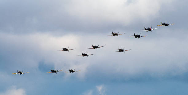 Duxford Airfield Cambridge, United Kingdom -  July 13th 2014:\n\nWarbird fighter planes perform in the skies at Duxford flying legends