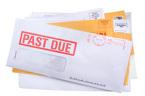 A pile of bills /junk mail with a final notice bill on top. Add your own text and address.