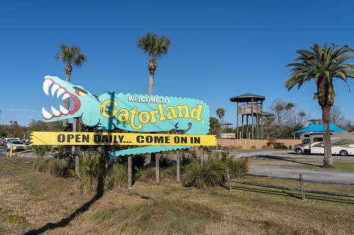 Orlando, Florida, USA - January 31, 2022: Gatorland welcome sign is shown in Orlando, Florida, USA. Gatorland is a 110-acre theme park and wildlife preserve in Florida.