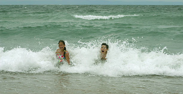 istock Children in the sea 139981855