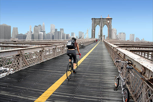 Brooklyn Bridge cyclist stock photo