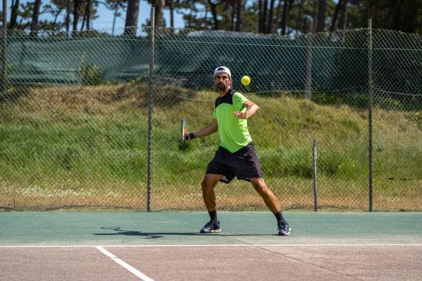 istock Tennis player hitting forehand at ball 1399822076