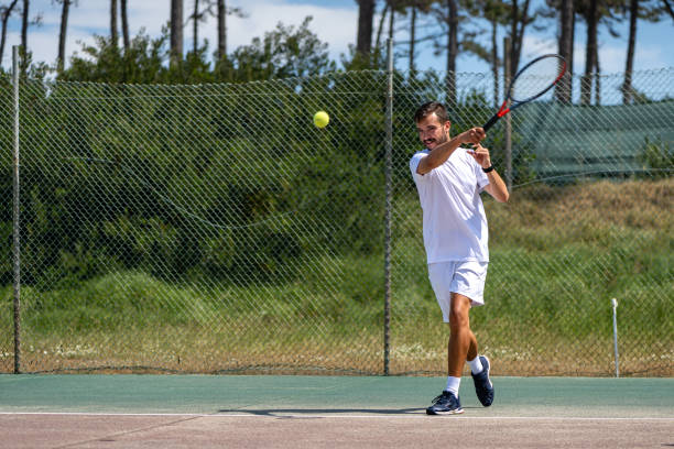istock Tennis player hitting forehand at ball 1399822123
