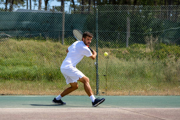 istock Tennis player hitting backhand at ball 1399822126
