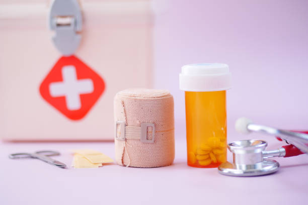 istock first aid kit box and medical pill on table 1399830678