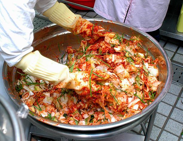 Making Korean Kimchi Spicy Cabbage stock photo