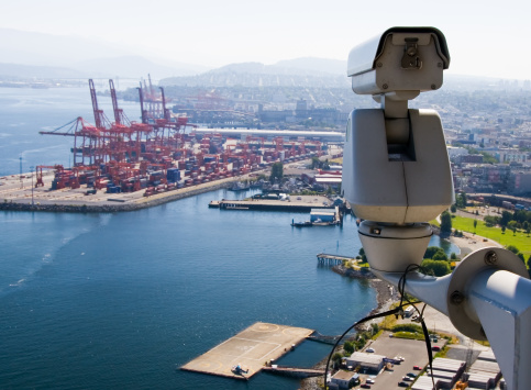 Surveillance Camera is watching  operations in the port.