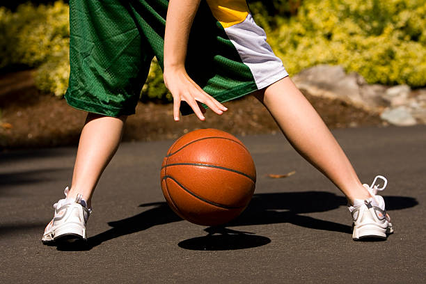 istock Girl Dribbling Basketball 139983130