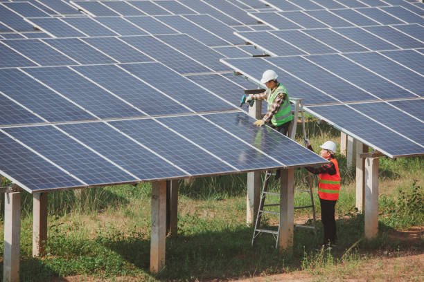 istock worker installing the solar panels.Solar power energy. renewable energy, technology, electricity, Solar power plant. worker maintenance of solar power plants who perform inspections and maintenance of solar power plants. 1399831491