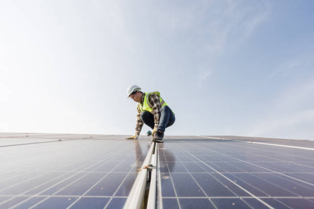 istock worker installing the solar panels.Solar power energy. renewable energy, technology, electricity, Solar power plant. worker maintenance of solar power plants who perform inspections and maintenance of solar power plants. 1399831753