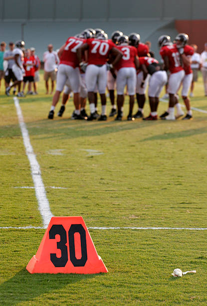 american football players in the action grand arena