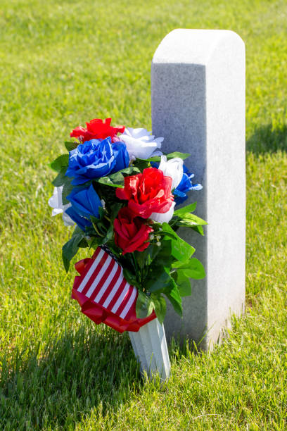 istock Military gravestone with flowers 1399831821