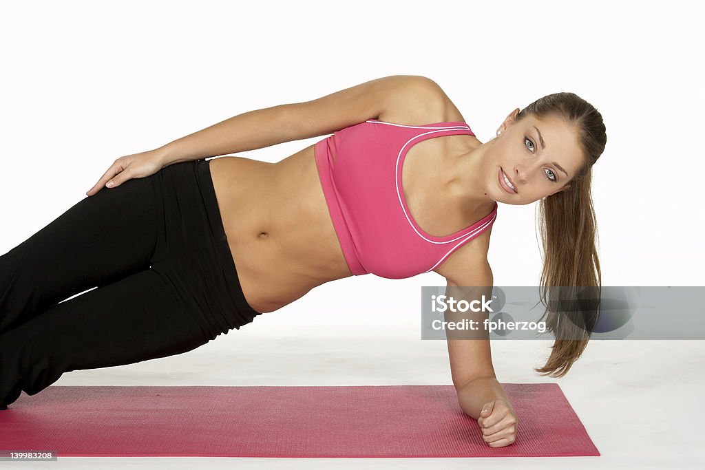 Schöne Junge Frau in Seite Plank - Lizenzfrei Bildhintergrund Stock-Foto