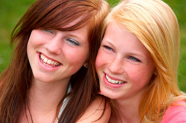 istock Two young female friends looking away 139983693