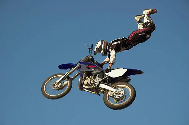 Moto X Freestyle rider high in sky