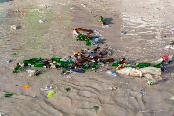 Consequences of sea water pollution on the Haad Rin beach after the full moon party in island Koh Phangan, Thailand stock photo