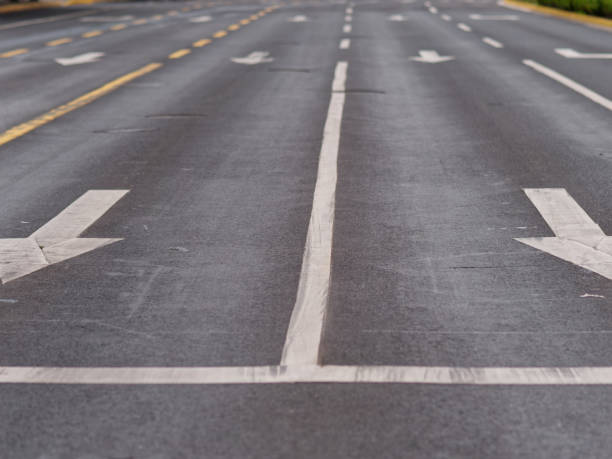 istock Two arrow marking signs on empty road, no traffic during Shanghai lockdown. 1399842320