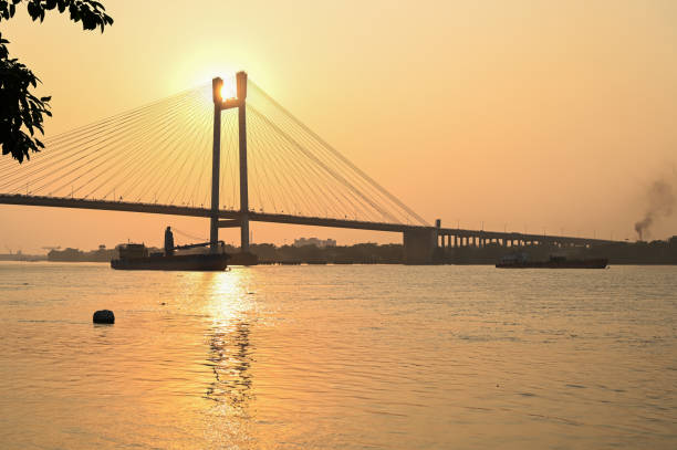 istock Beautiful famous Kolkata Hoogly bridge in sunset . 1399844490
