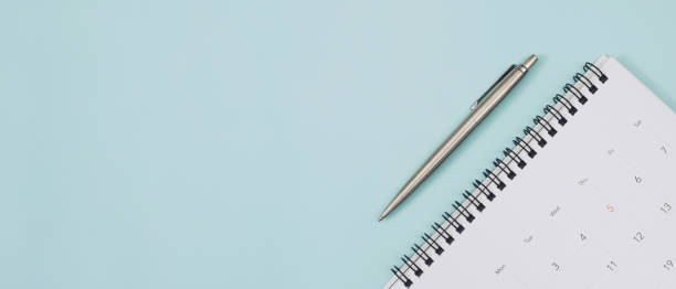 istock calendar on the blue. empty copy space for text. concept for busy timeline organize schedule,appointment and meeting reminder. planning for business meeting or travel holiday planning concept. 1399844502